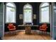 Sitting area with arched windows, unique table, and chairs, ideal for quiet conversations or relaxation at 4799 Winterview Ln, Douglasville, GA 30135