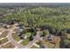 An aerial view of a home nestled in a neighborhood surrounded by lush greenery at 7228 Silverleaf Cir, Fairburn, GA 30213