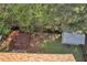 Aerial view of the backyard with a large deck and shed at 7228 Silverleaf Cir, Fairburn, GA 30213