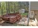 Backyard with a large deck, shed and mature trees at 7228 Silverleaf Cir, Fairburn, GA 30213