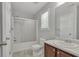 A full bath with a tub and shower combination and wood vanity with sink at 7228 Silverleaf Cir, Fairburn, GA 30213