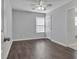 This cozy bedroom features hardwood floors, neutral paint and a ceiling fan at 7228 Silverleaf Cir, Fairburn, GA 30213