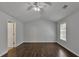 Spacious primary bedroom featuring hardwood floors, ceiling fan, and ample natural light at 7228 Silverleaf Cir, Fairburn, GA 30213