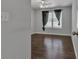 Inviting bedroom with a ceiling fan, neutral wall paint, and a window with black curtains at 7228 Silverleaf Cir, Fairburn, GA 30213