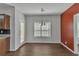 Cozy dining area featuring hardwood floors and a chandelier, next to kitchen at 7228 Silverleaf Cir, Fairburn, GA 30213