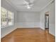 Elegant dining room with hardwood floors, wainscoting, and a ceiling fan at 7228 Silverleaf Cir, Fairburn, GA 30213