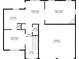 First floor layout featuring a kitchen, living room, dining area, and garage at 7228 Silverleaf Cir, Fairburn, GA 30213