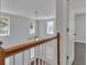 Foyer with a nice railing and natural light at 7228 Silverleaf Cir, Fairburn, GA 30213