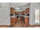Spacious kitchen with wooden cabinets, granite countertops, and stainless steel appliances at 7228 Silverleaf Cir, Fairburn, GA 30213