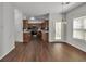 Open concept kitchen with stainless steel appliances, ample counter space, and warm wood cabinets at 7228 Silverleaf Cir, Fairburn, GA 30213