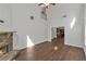 Spacious living room with a stone fireplace, hardwood floors, and soaring ceilings at 7228 Silverleaf Cir, Fairburn, GA 30213