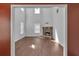 Open living room featuring a stone fireplace and large windows for natural light at 7228 Silverleaf Cir, Fairburn, GA 30213