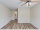 Large bedroom featuring wood-look floors, ceiling fan and ensuite bathroom at 11205 Abbotts Station Dr, Duluth, GA 30097