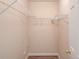 Walk-in closet providing ample space for organization with wire shelving and neutral walls at 11205 Abbotts Station Dr, Duluth, GA 30097