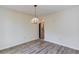 Cozy dining room showcasing new flooring, neutral paint, and a charming light fixture at 11205 Abbotts Station Dr, Duluth, GA 30097
