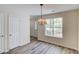 Well-lit dining room featuring new flooring, and convenient access to other areas at 11205 Abbotts Station Dr, Duluth, GA 30097