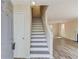 Bright foyer showcasing newly installed floors and a staircase leading to the upper level at 11205 Abbotts Station Dr, Duluth, GA 30097