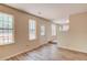 Inviting living room with natural light, wood-look floors, and a view of the backyard deck at 11205 Abbotts Station Dr, Duluth, GA 30097