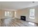 Bright living room showcasing new floors, a classic fireplace, and large windows at 11205 Abbotts Station Dr, Duluth, GA 30097
