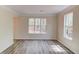 Spacious living room with new flooring, neutral paint, and an inviting atmosphere at 11205 Abbotts Station Dr, Duluth, GA 30097
