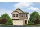 Charming two-story home features a two-car garage, craftsman details, and neutral exterior paint at 1254 Riverstone Rd, Jonesboro, GA 30238