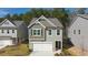 Stylish home featuring craftsman details, a two-car garage, and landscaping at 1254 Riverstone Rd, Jonesboro, GA 30238