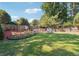 Well-maintained backyard featuring a large yard, swing, and lounge chairs at 1490 Rivershyre Pkwy, Lawrenceville, GA 30043