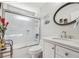 Bathroom featuring a glass-enclosed shower, a white vanity, and decorative accents at 1490 Rivershyre Pkwy, Lawrenceville, GA 30043