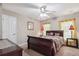 Bedroom with dark wooden furniture, matching lamps, and natural light at 1490 Rivershyre Pkwy, Lawrenceville, GA 30043