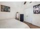Cozy bedroom with double doors, carpet, and large landscape painting at 1490 Rivershyre Pkwy, Lawrenceville, GA 30043