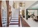 Grand foyer with staircase, high ceilings, and open floor plan offers a welcoming entry to the home at 1490 Rivershyre Pkwy, Lawrenceville, GA 30043