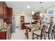 Spacious kitchen with granite countertops, modern stainless appliances, and an island with seating at 1490 Rivershyre Pkwy, Lawrenceville, GA 30043
