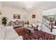 Cozy living room with classic furnishings and a view through to the entry and dining areas at 1490 Rivershyre Pkwy, Lawrenceville, GA 30043