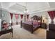 Large bedroom with tray ceiling, a ceiling fan, and lots of natural light at 1490 Rivershyre Pkwy, Lawrenceville, GA 30043