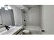 Modern bathroom showcasing tiled walls, new fixtures, and a shower-tub combination at 2388 Lawrenceville Hwy # D, Decatur, GA 30033