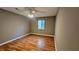 Cozy bedroom with wood floors, a ceiling fan, and natural light at 2388 Lawrenceville Hwy # D, Decatur, GA 30033