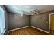 Well lit bedroom with hardwood floors and ceiling fan at 2388 Lawrenceville Hwy # D, Decatur, GA 30033