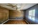 Comfortable bedroom boasts natural light, ceiling fan, and wood-look flooring at 2388 Lawrenceville Hwy # D, Decatur, GA 30033