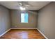 Cozy bedroom features a ceiling fan, window for natural light, and wood-look flooring at 2388 Lawrenceville Hwy # D, Decatur, GA 30033
