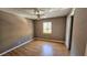 Bedroom featuring a ceiling fan, window, and neutral color palette at 2388 Lawrenceville Hwy # D, Decatur, GA 30033