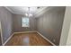 Cozy dining room with wood floors and chandelier lighting at 2388 Lawrenceville Hwy # D, Decatur, GA 30033