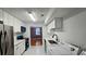 Modern kitchen with white cabinets, updated appliances, and marble floors at 2388 Lawrenceville Hwy # D, Decatur, GA 30033