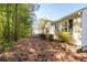 Well maintained backyard with a view of the rear of the house at 548 W Oaks Dr, Woodstock, GA 30188