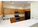 A well-lit kitchen with modern appliances and quartz countertops providing ample counter space at 548 W Oaks Dr, Woodstock, GA 30188