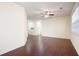 Spacious living room with dark wood floors, high ceilings, and large windows at 548 W Oaks Dr, Woodstock, GA 30188