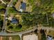 Aerial view shows the beautiful estate grounds with lush trees surrounding the home on a spacious lot at 200 Sugar Mill Ln, Canton, GA 30115