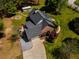 Aerial view of the home showing the manicured yard, large driveway and outbuilding at 200 Sugar Mill Ln, Canton, GA 30115