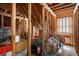 Unfinished attic space with exposed wood beams and natural light, offering storage at 200 Sugar Mill Ln, Canton, GA 30115