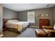 Cozy bedroom featuring carpet flooring, a decorative dresser and sitting area at 200 Sugar Mill Ln, Canton, GA 30115