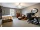 Bedroom featuring carpet flooring, a work space, and an armchair sitting area at 200 Sugar Mill Ln, Canton, GA 30115
